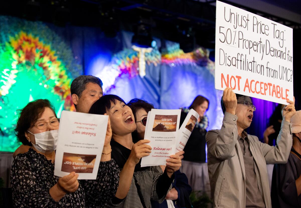 Members of congregations attempting to leave the United Methodist Church protest during a meeting in Los Angeles on June 17.