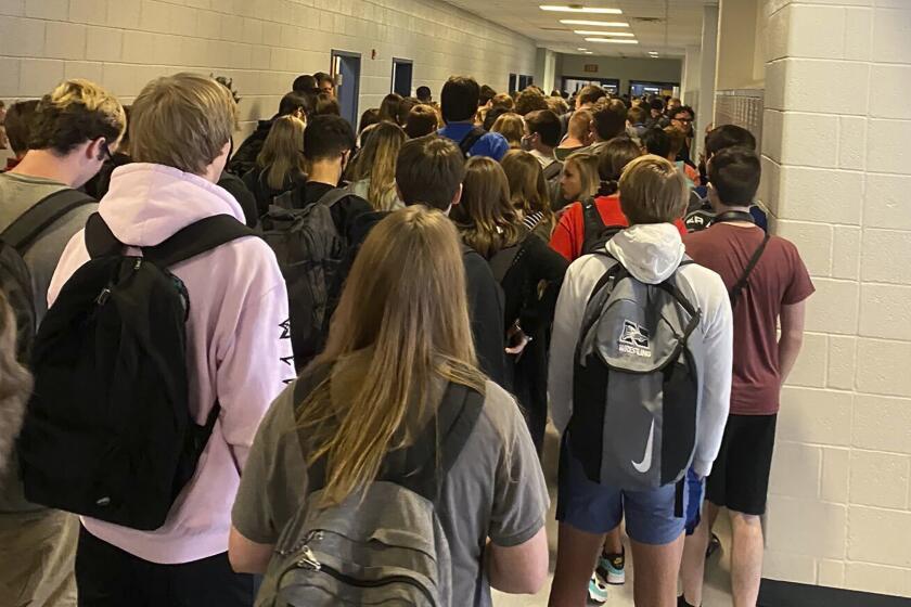 Students crowd a hallway at North Paulding High School in Dallas, Ga.   