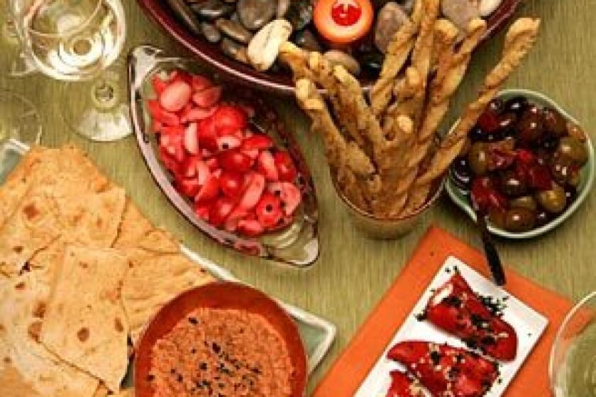 These easy-to-prepare appetizers require little or no oven time, yet go a long way toward making Thanksgiving dinner special. They include quick-pickled radishes, lavash crackers and muhammara, stuffed piquillo peppers and home-cured olives.