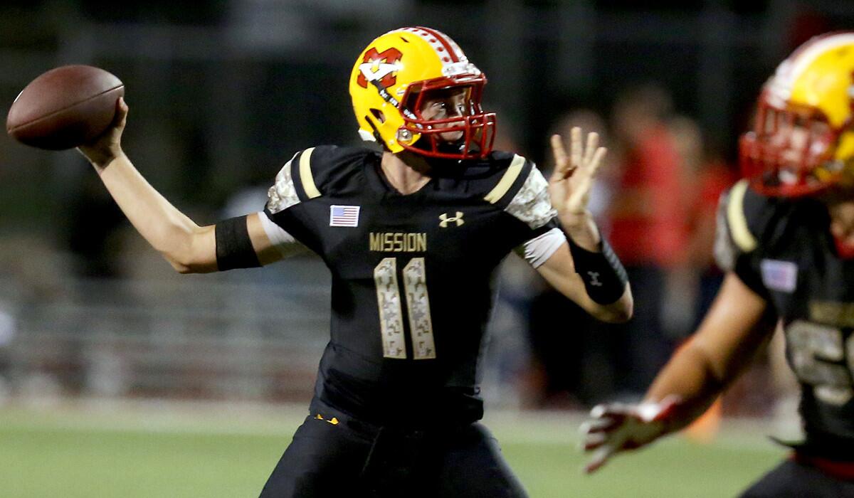 Mission Viejo quarterback Brock Johnson throws downfield aganst Norco in the second quarter on Sept. 18 at Mission Viejo High School.