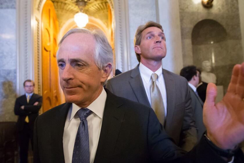 FILE--In this file photo from Thursday, Feb. 28, 2013, Sen. Bob Corker, R-Tenn., left, and Sen. Jeff Flake, R-Ariz., right, leave the chamber after votes on federal spending reductions, at the Capitol in Washington. President Donald Trump is lashing out at the two Republican senators who have recently seared him with criticism, commenting on his Twitter account Wednesday that neither are running for re-election because "they had zero chance of being elected." (AP Photo/J. Scott Applewhite, file)