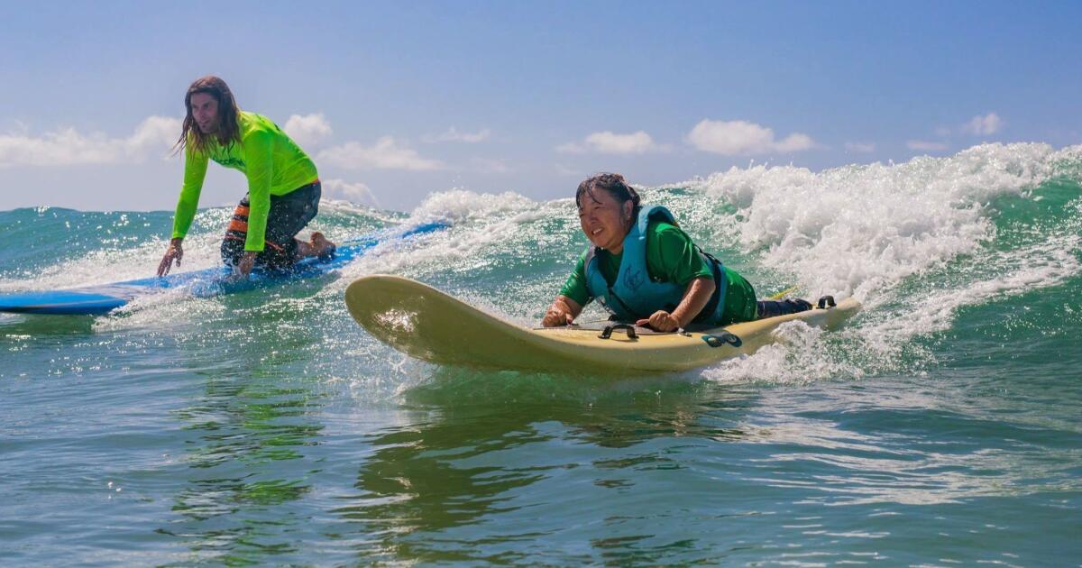 On Oahu, people with physical or cognitive disabilities become surfers with  an assist from this group - Los Angeles Times