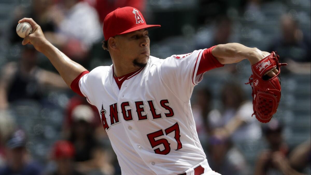 Angels relief pitcher Hansel Robles throws during the third inning against the Seattle Mariners on April 21.