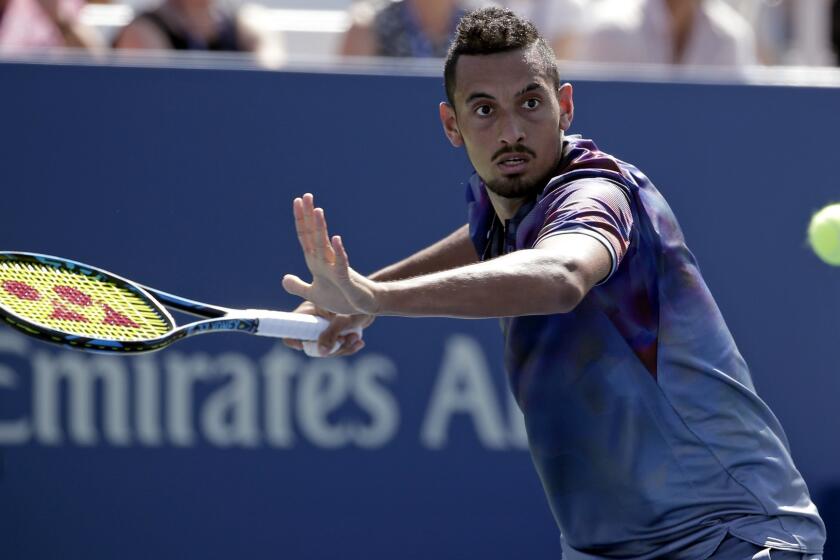 Nick Kyrgios, of Australia, returns a shot from John Millman, of Australia, during the first round of the U.S. Open tennis tournament, Wednesday, Aug. 30, 2017, in New York. (AP Photo/Seth Wenig)