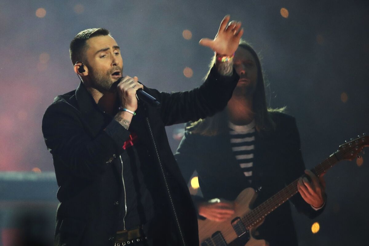 FILE -Adam Levine of Maroon 5 performs during halftime of the NFL Super Bowl 53 football game between the Los Angeles Rams and the New England Patriots Sunday, Feb. 3, 2019, in Atlanta. Maroon 5 and Usher will headline a benefit concert in Atlanta to honor the legacy of the late U.S. Rep. John Lewis. The Grammy Award-winning pop band and singer will perform during the Beloved Benefit at the Mercedes-Benz Stadium on July 7, concert officials announced Thursday, May 5, 2022. (AP Photo/Matt Rourke, File)