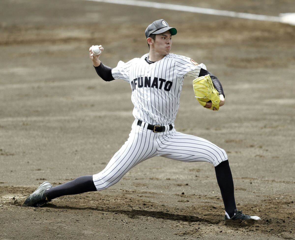 Ofunato High senior Rouki Sasaki pitches in a regional tournament game against Tono Ryokuho on July 16 in Hanamaki, Japan.