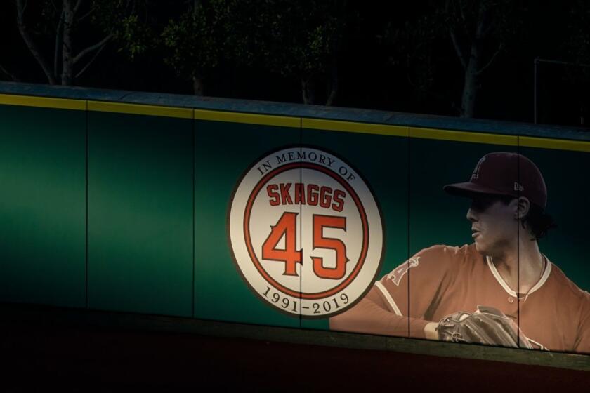 ANAHEIM, CALIF. - JULY 12: A marker is seen in the outfield in memory of the late Tyler Skaggs, before the start of a Major League Baseball game at Angel Stadium on Friday, July 12, 2019 in Anaheim, Calif. (Kent Nishimura / Los Angeles Times)