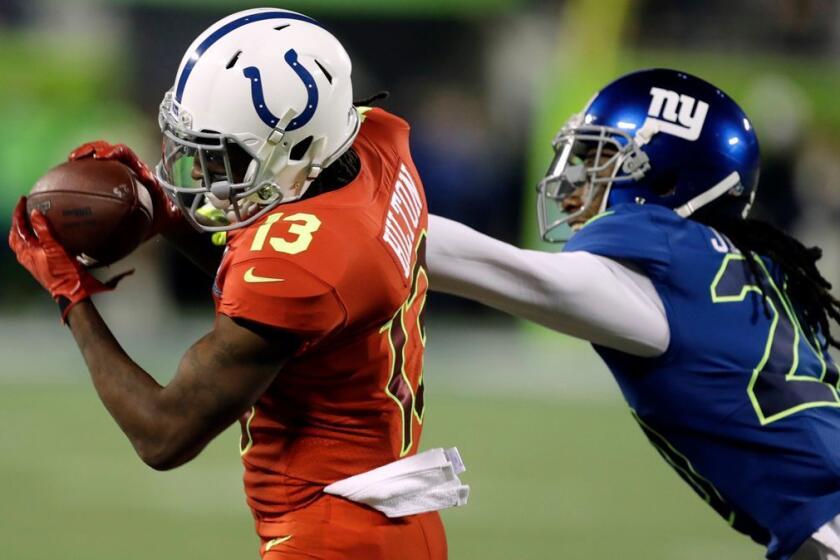 AFC wide receiver T.Y. Hilton of the Indianapolis Colts, left, makes a catch over NFC cornerback Janoris Jenkins of the New York Giants during the first half of the NFL Pro Bowl football game on Jan. 29.