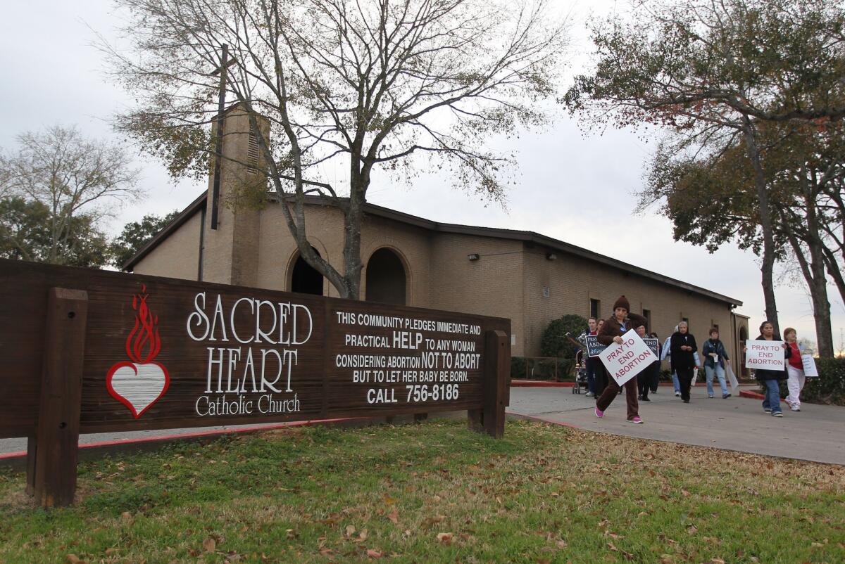 Antiabortion protesters gather at Sacred Heart Catholic Church in Conroe, Texas, in January to mark the 41st anniversary of Roe vs. Wade, the Supreme Court ruling that struck down antiabortion laws. Texas is one of the battlegrounds over new legislation designed to restrict abortion.