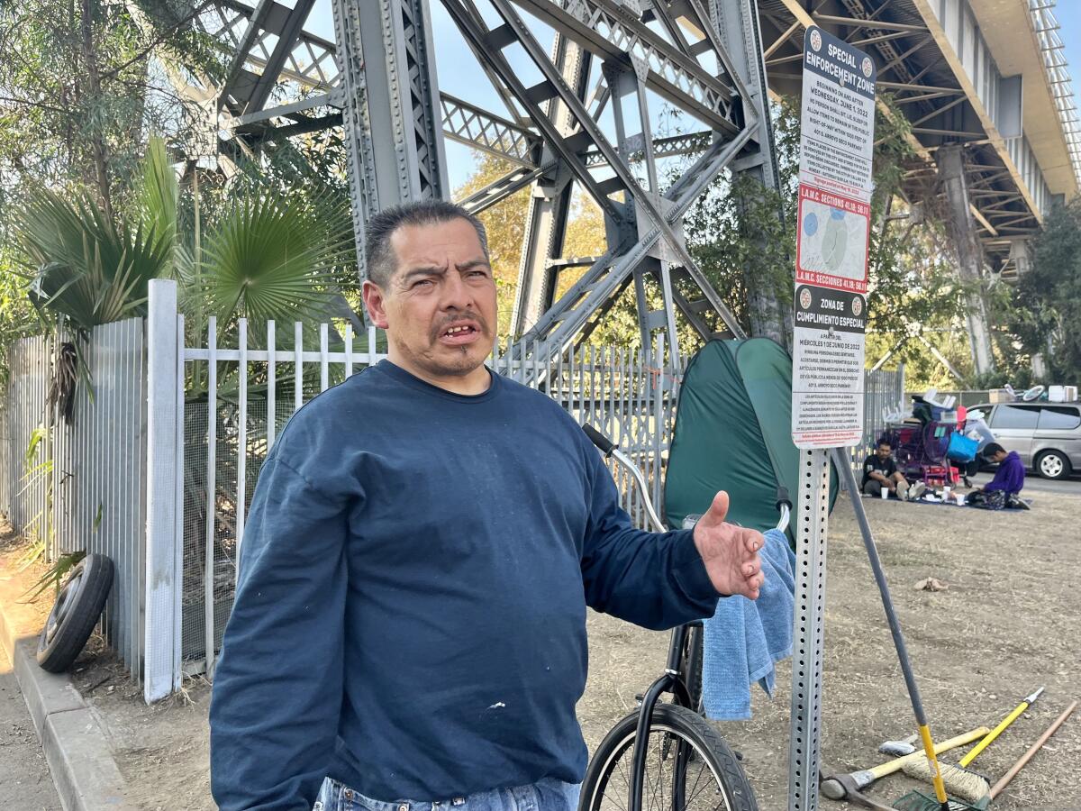 A man under an overpass.