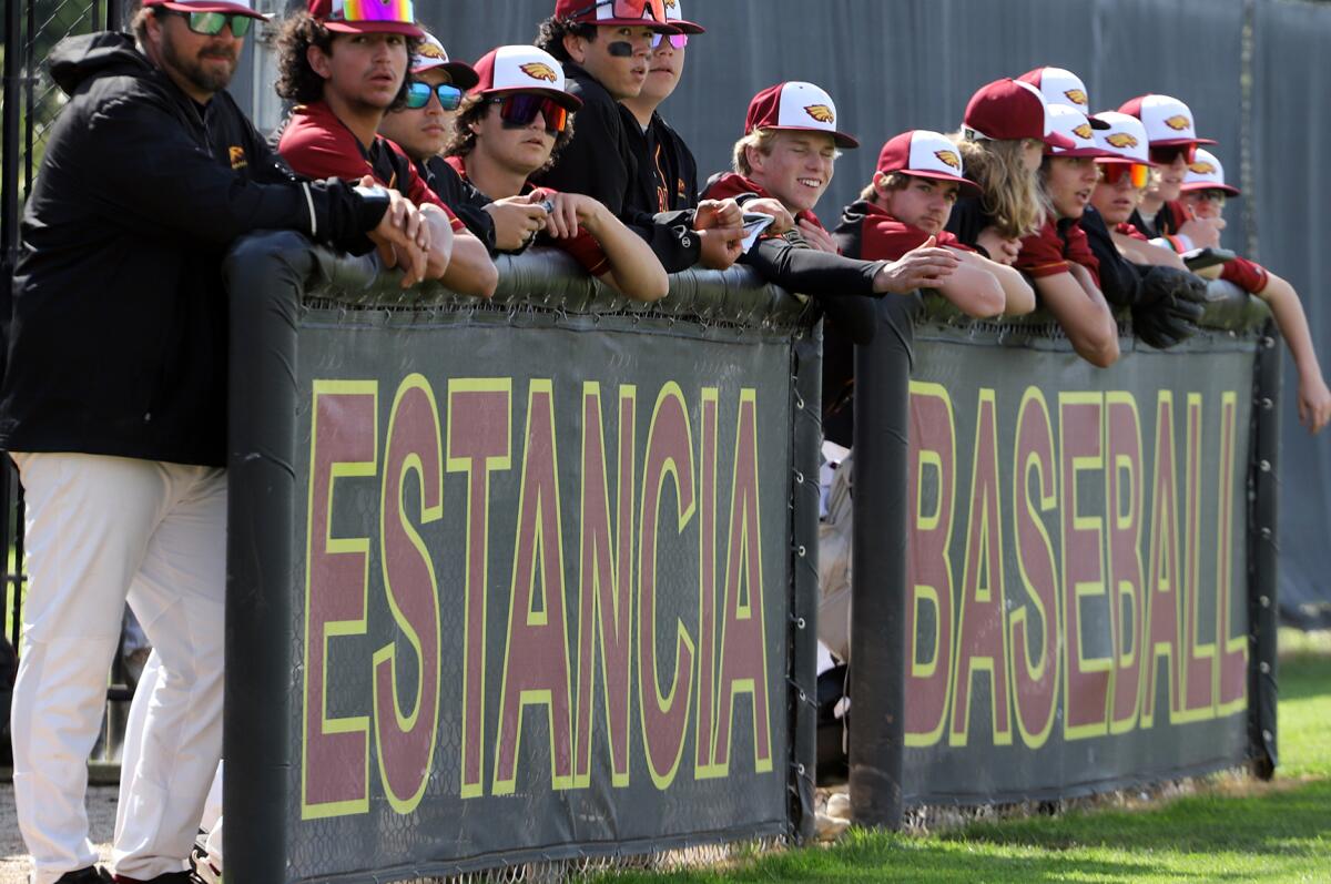 Estancia High School baseball team members watch their teammates play against Calvary Chapel on Friday.