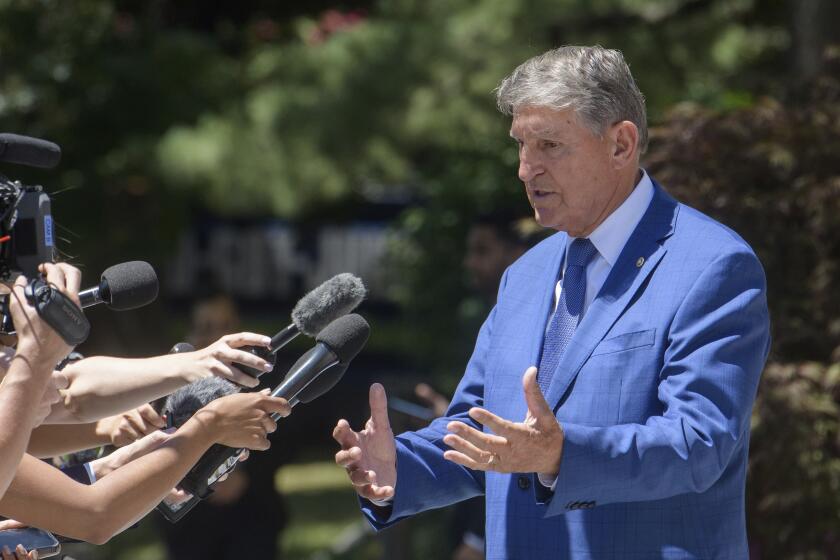 Sen. Joe Manchin, D-W.Va., takes a moment to talk with reporters as he arrives at the Democratic Senatorial Campaign Committee on Capitol Hill, Thursday, July 11, 2024, in Washington. (AP Photo/Rod Lamkey, Jr.)