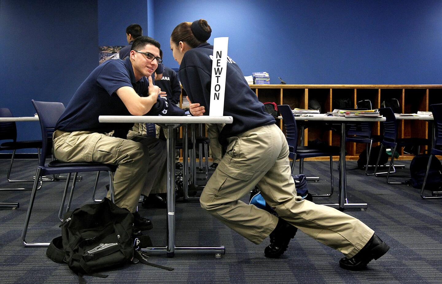 Jesus Torres, left, and Natalie Aguirre, students in the Police Orientation Preparation Program, chat during lunch break.