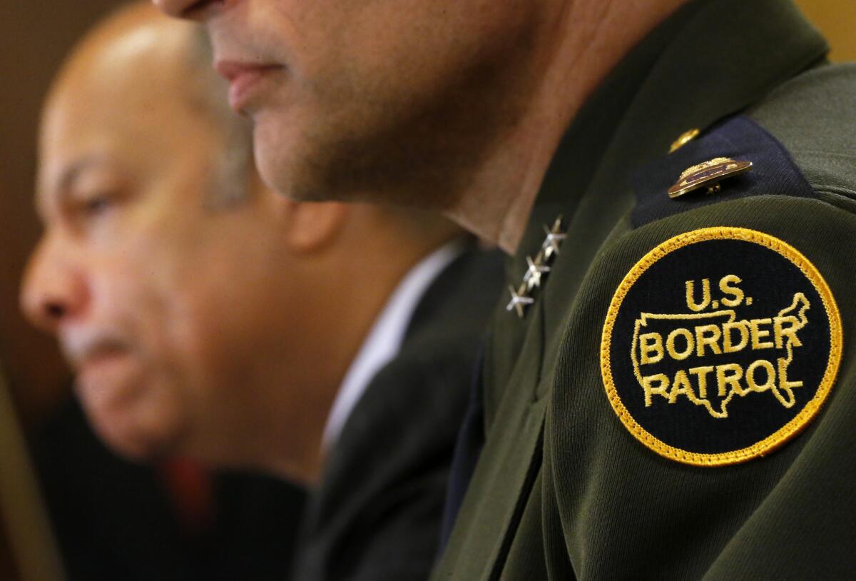 Homeland Security Secretary Jeh Johnson, left, sits with Deputy Chief of Border Patrol Ronald D. Vitiello, on Capitol Hill in Washington.