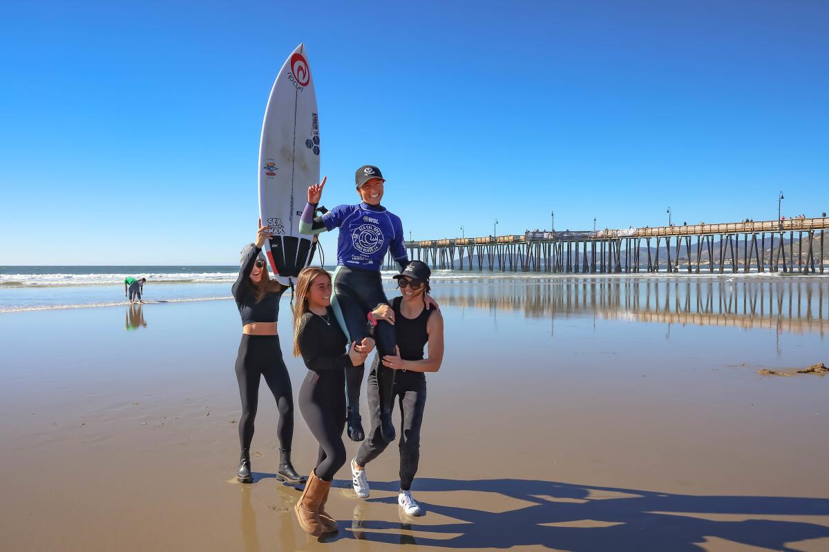 Alyssa Spencer is hoisted after her win at the SLO CAL Open Pismo Beach.