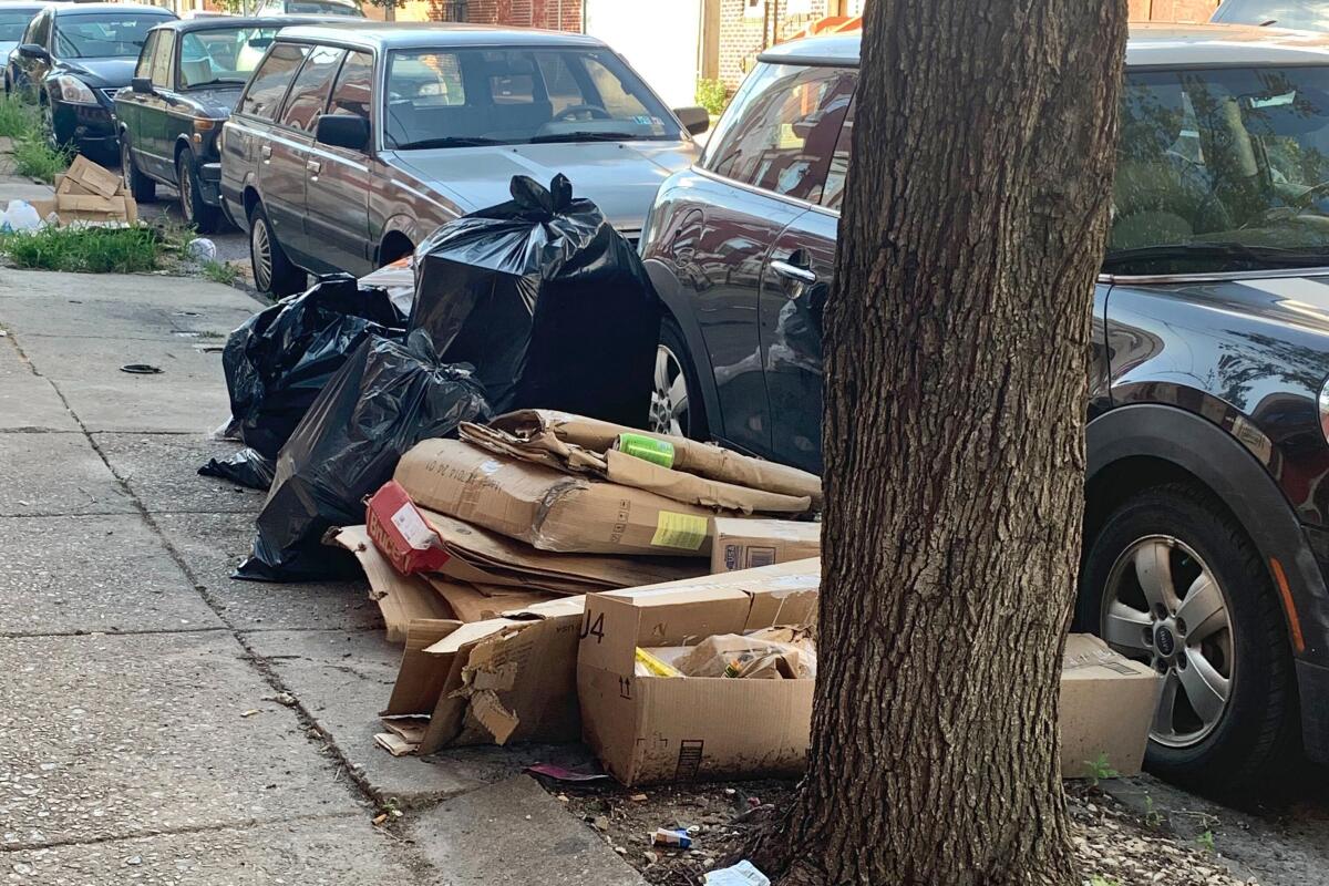 Trash is piled up on a street in the Kensington neighborhood of Philadelphia.