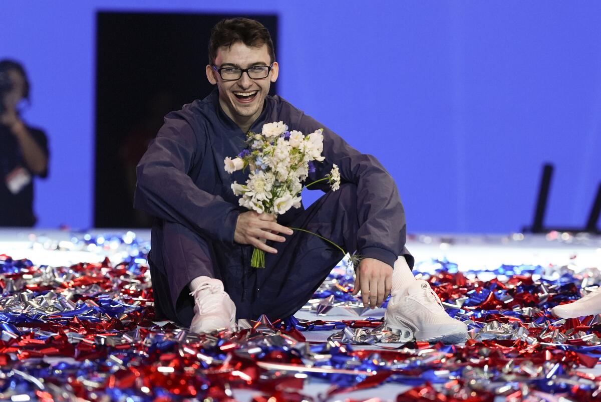 Stephen Nedoroscik hold a bouquet of flowers and smiles after being named to the U.S. Olympic team 