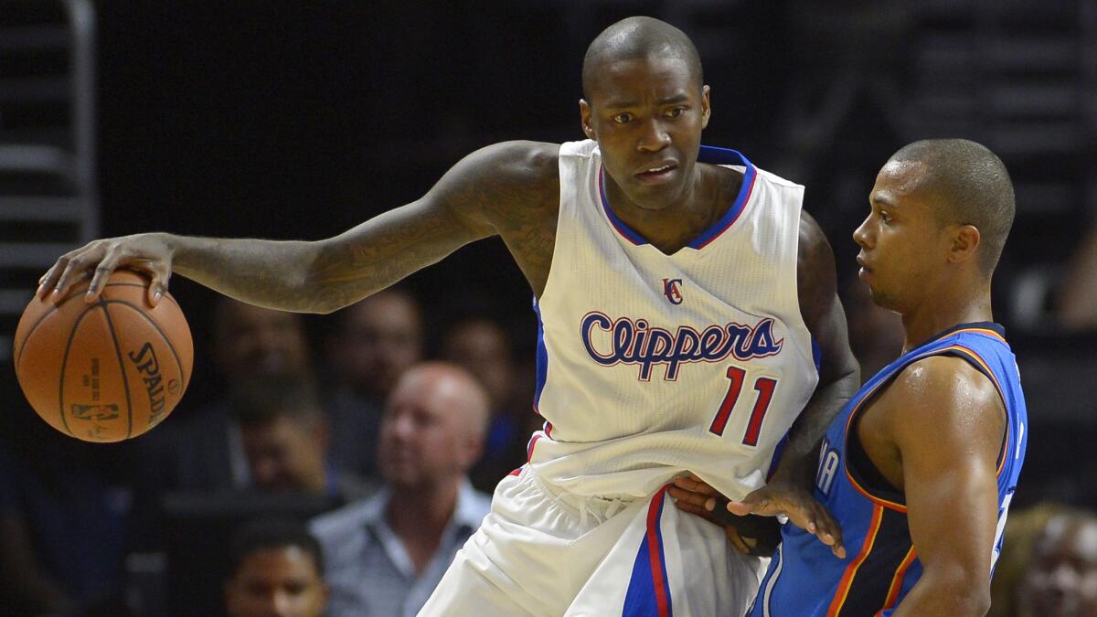 Clippers guard Jamal Crawford, left, tries to work past Oklahoma City Thunder guard Sebastian Telfair during a game on Oct. 30.