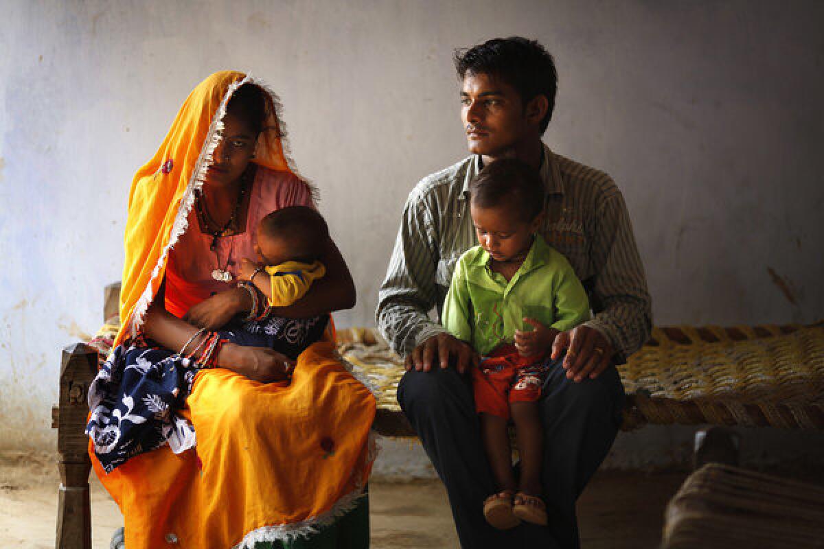 Ramjee Lal Kumhar, right, and wife Mamta hold their toddler son Karan and infant daughter Kusum in their village in India's northern state of Rajasthan. The couple are part of the largest generation in history -- 3 billion people under the age of 25. With so many entering or already in their reproductive years, the impact on the planet will be huge.