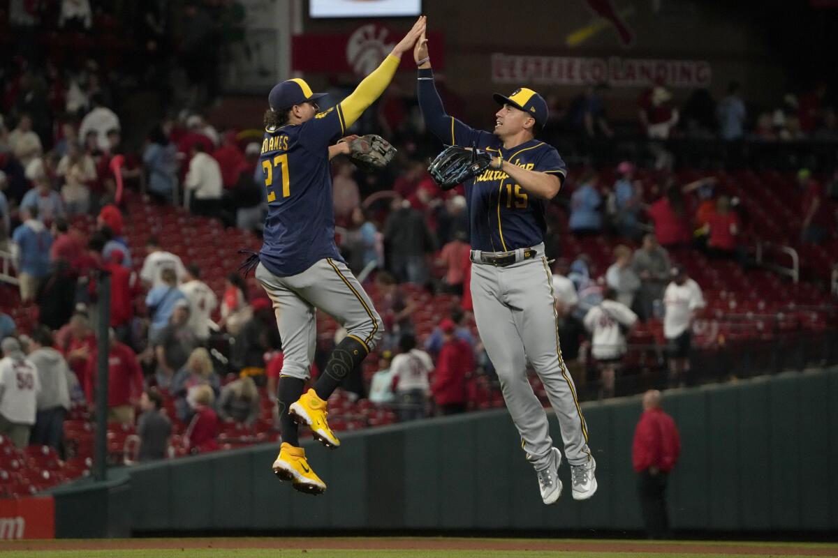 Tyrone Taylor of the Milwaukee Brewers celebrates after scoring on