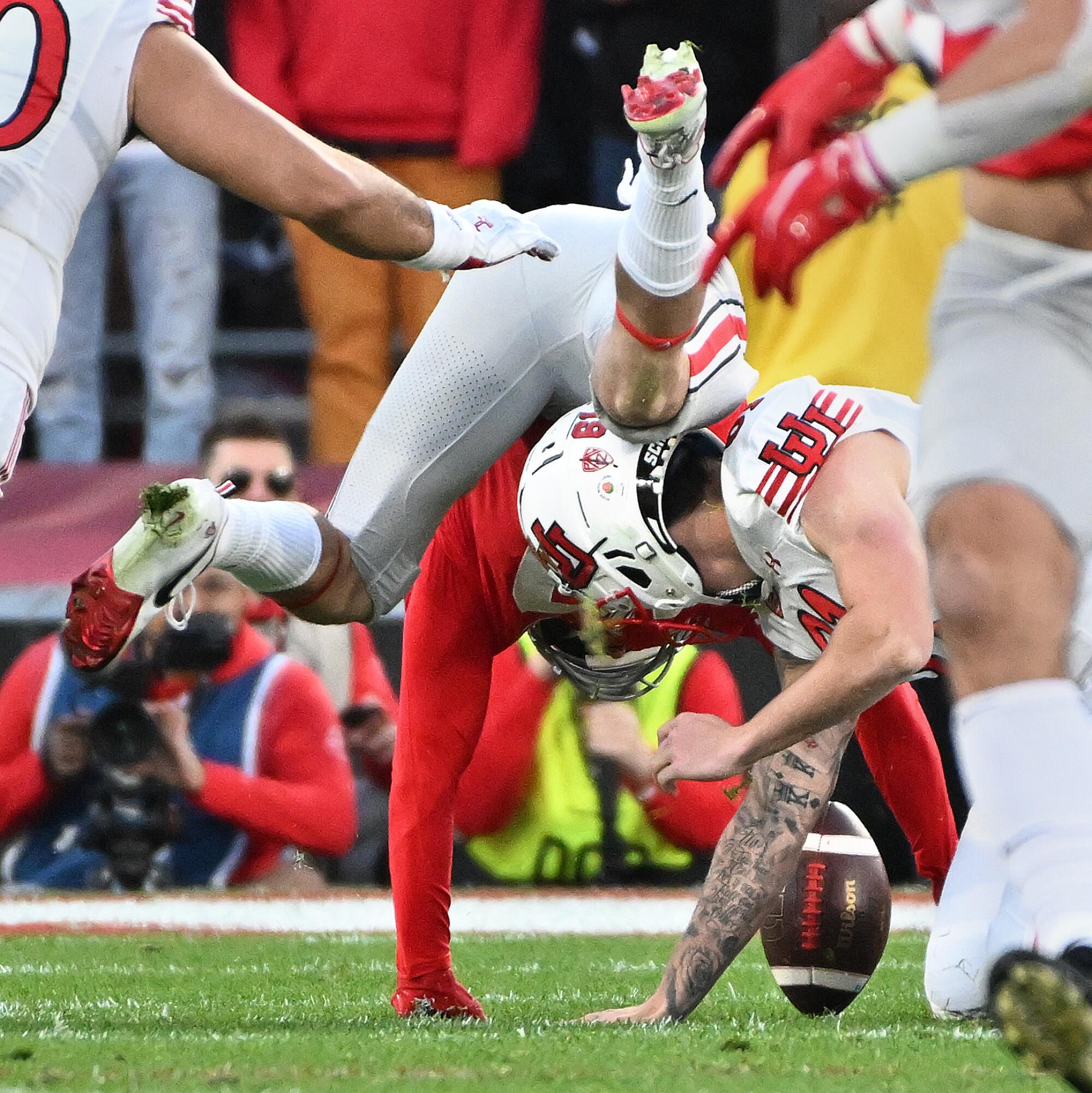 Utah punter Michael Williams muffs a punt.