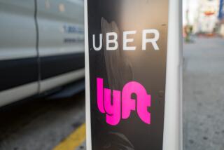 Close-up of vertical sign with logos for ridesharing companies Uber and Lyft, with wheels of a car in the background, indicating a location where rideshare pickups are available in downtown Los Angeles, California, October 24, 2018. (Photo by Smith Collection/Gado/Getty Images)