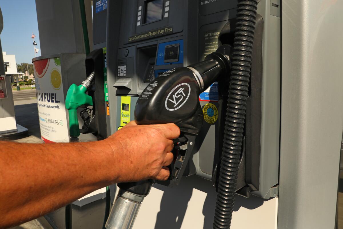 A man fills his truck with gas