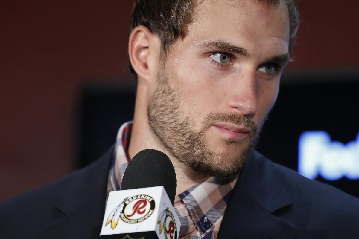 Washington Redskins quarterback Kirk Cousins listens to a question during a postgame news conference Sunday.