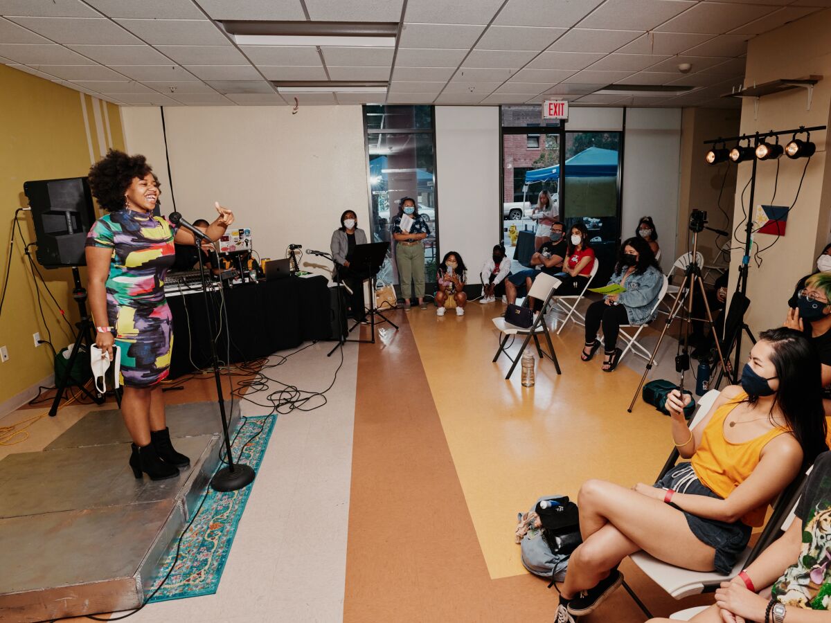 Featured poet Aiyana Sha'niel performs a poem at the Sunday Jump inside the Pilipino Workers Center.