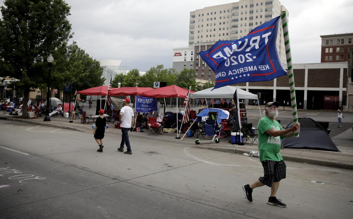 Mike Pellerin joins other Trump supporters on 4th Street and Cheyenne Ave. in downtown Tulsa, Okla.