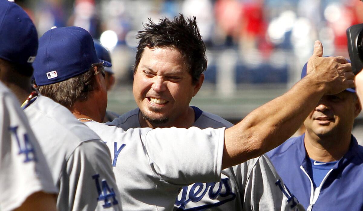 Dodgers pitcher Josh Beckett gets a hug from Manager Don Mattingly after pitching a no-hitter against the Phillies on Sunday afternoon in Philadelphia.