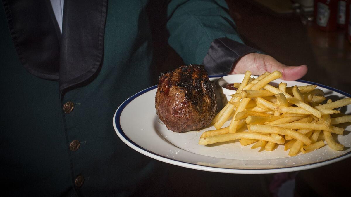 The "Training Day" baseball steak and fries, named after a scene from the 2001 film "Training Day," which was shot at the Pacific Dining Car.