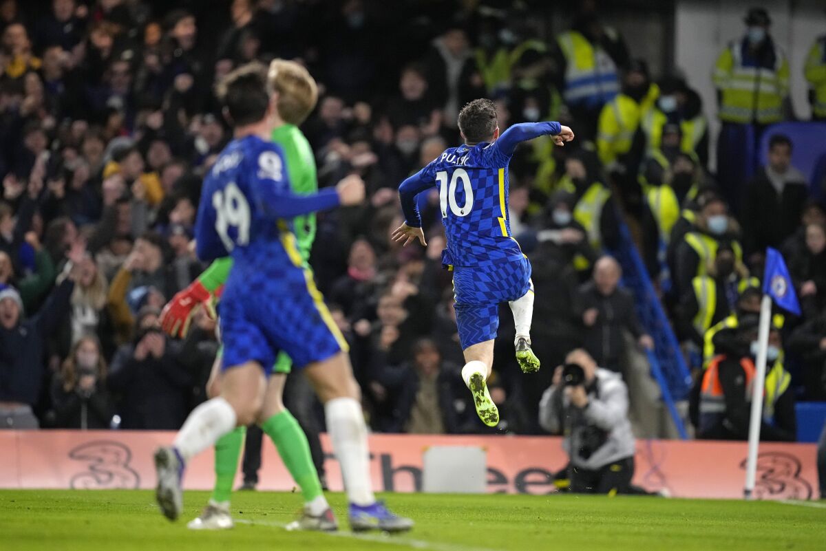 Chelsea's Christian Pulisic, right, celebrates after scoring his side's second goal during the English Premier League soccer match between Chelsea and Liverpool at Stamford Bridge in London, Sunday, Jan. 2, 2022. (AP Photo/Matt Dunham)