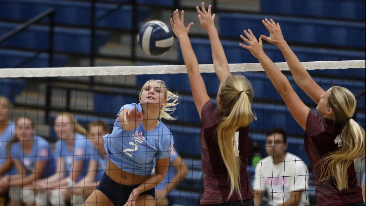 Nikki Senske (2) scores against Laguna Beach High during the first set of a Sunset Conference crossover match at Corona del Mar on Wednesday.