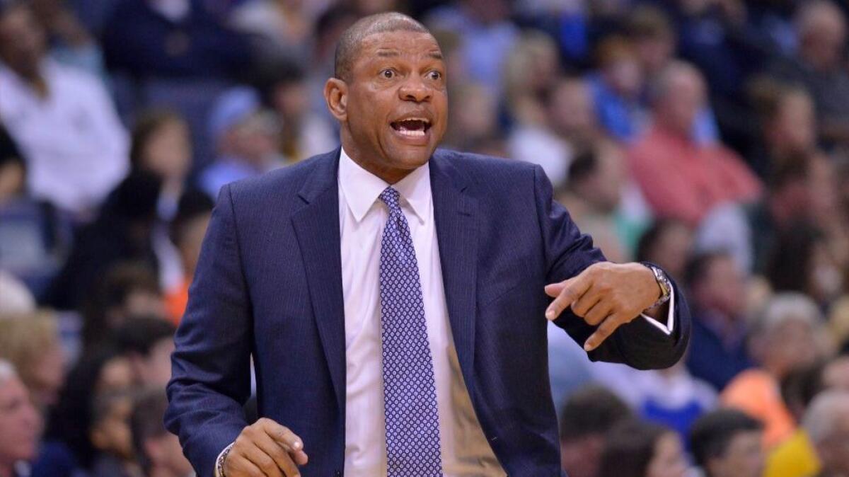 Clippers Coach Doc Rivers calls to players during the first half of a game against the Grizzlies on March 9.