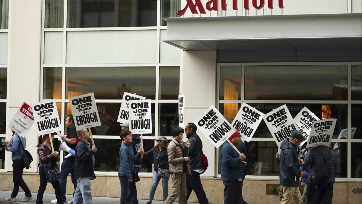 Workers picket a Marriott hotel in San Francisco on Oct. 4. A contract agreement has been reached between Marriott and bargainers in San Francisco.