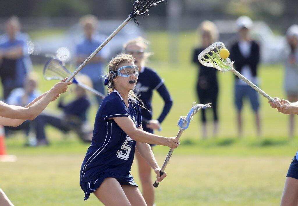 Newport Harbor High's Allana Rockwell aims for the net against Corona del Mar during the Battle of the Bay game on Friday.