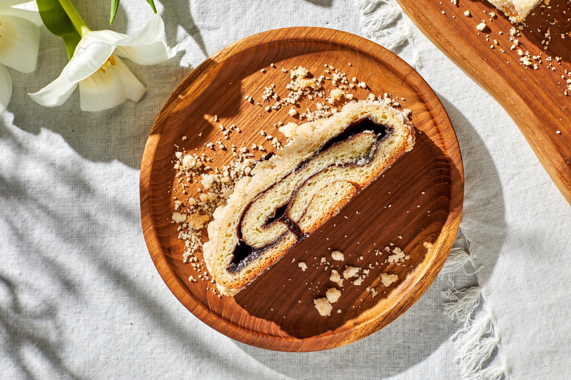 Kokosh cake is filled with a bittersweet filling and topped with crunchy crumbs.