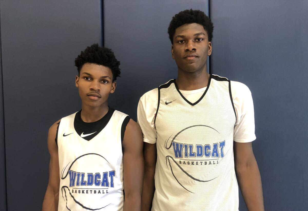 Sophomore point guard Dylan Andrews (left) and sophomore 6-foot-8 Kijani Wright have been important players for Windward in the early season.