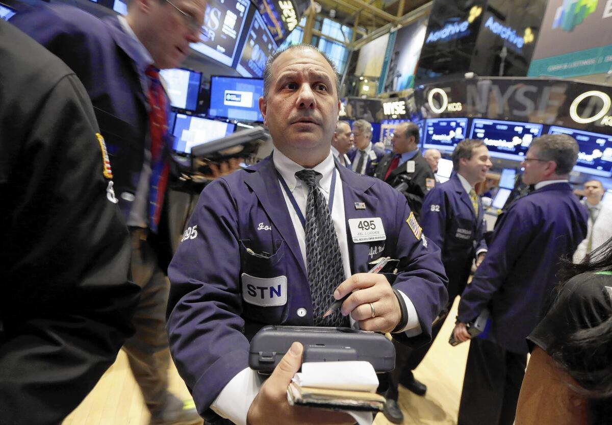 Stocks tumbled Friday, but the S&P 500 still is up 1% this year after bolting nearly 30% last year. Above, traders on the floor of the New York Stock Exchange.