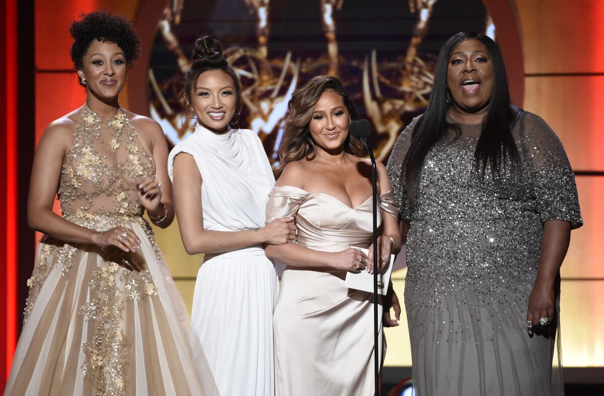 Four women presenting an award