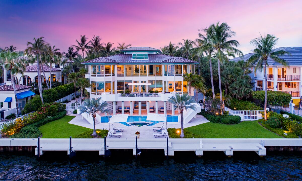 Spanning 8,300 square feet, the waterfront mansion holds six bedrooms, 7.5 bathrooms and a handful of chic, glass-filled living spaces.