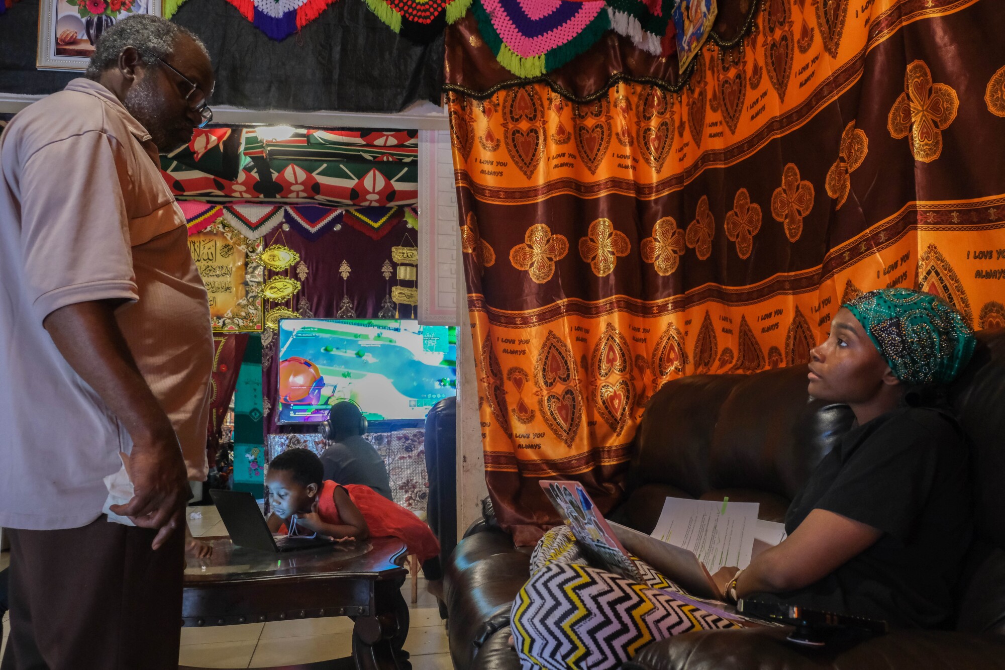 Famo Musa talks to her father before her classes