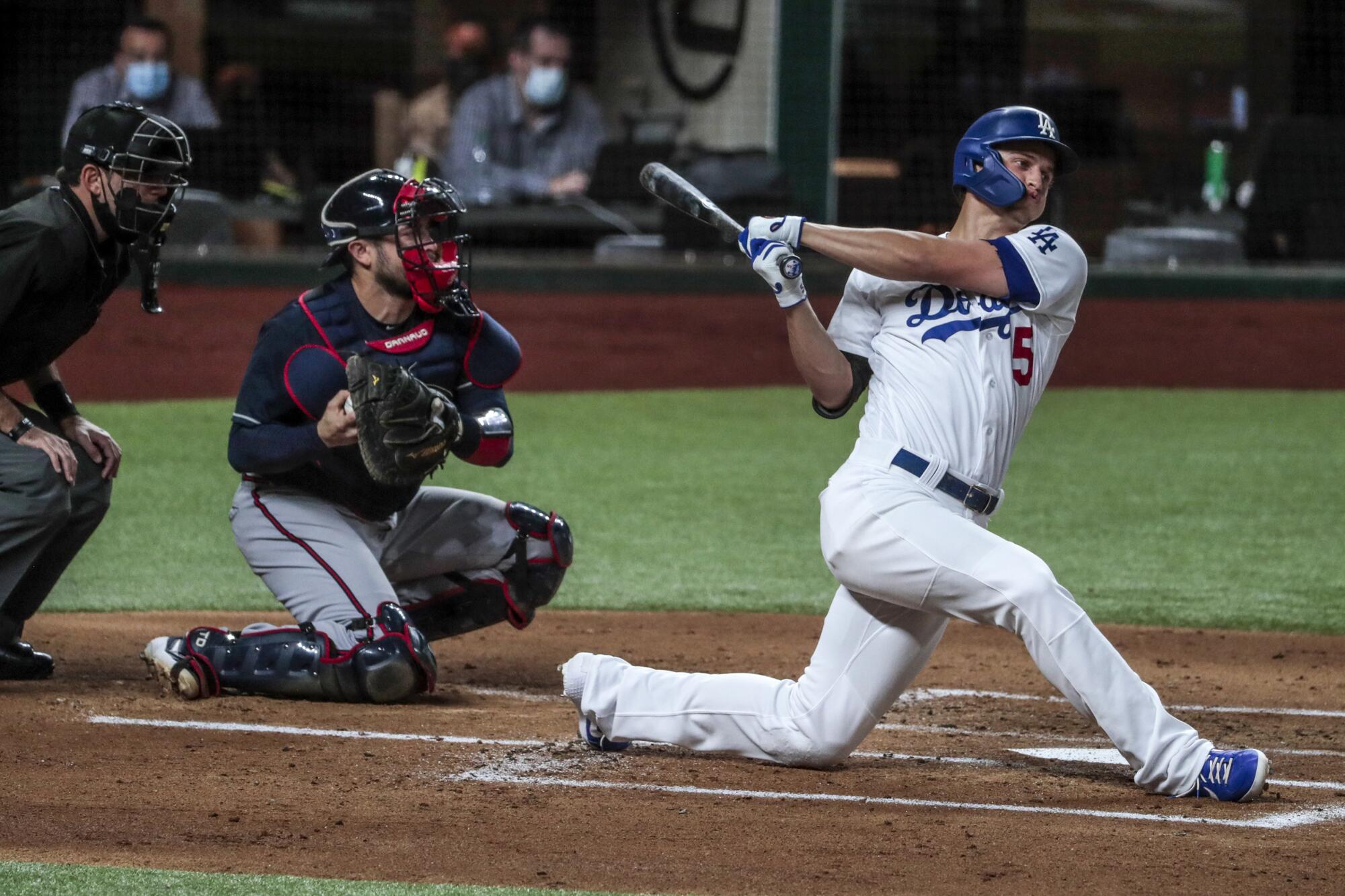 Dodgers shortstop Corey Seager swings at a pitch during Game 1 of the NLCS against the Atlanta Braves on Monday.