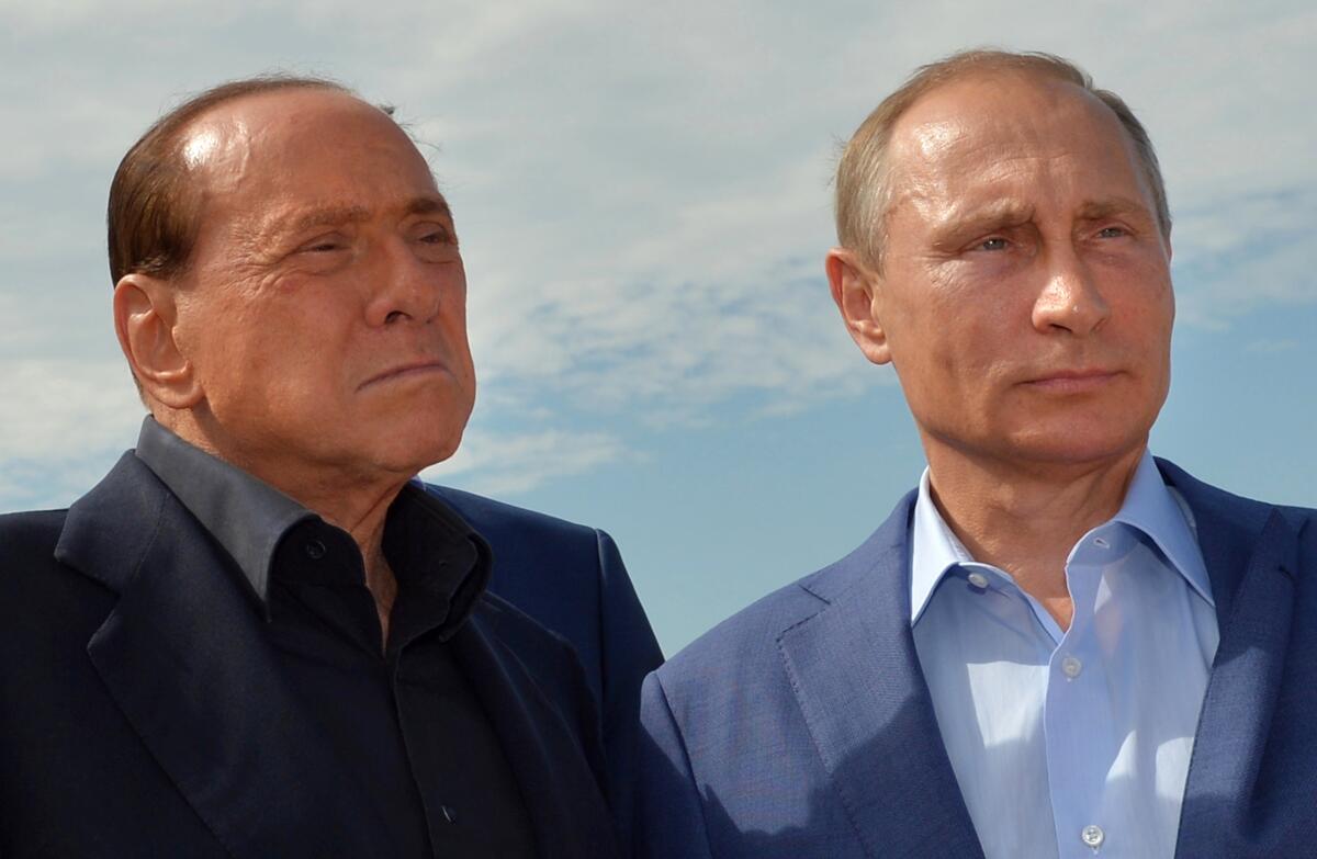 Former Italian Prime Minister Silvio Berlusconi and Russian President Vladimir Putin
