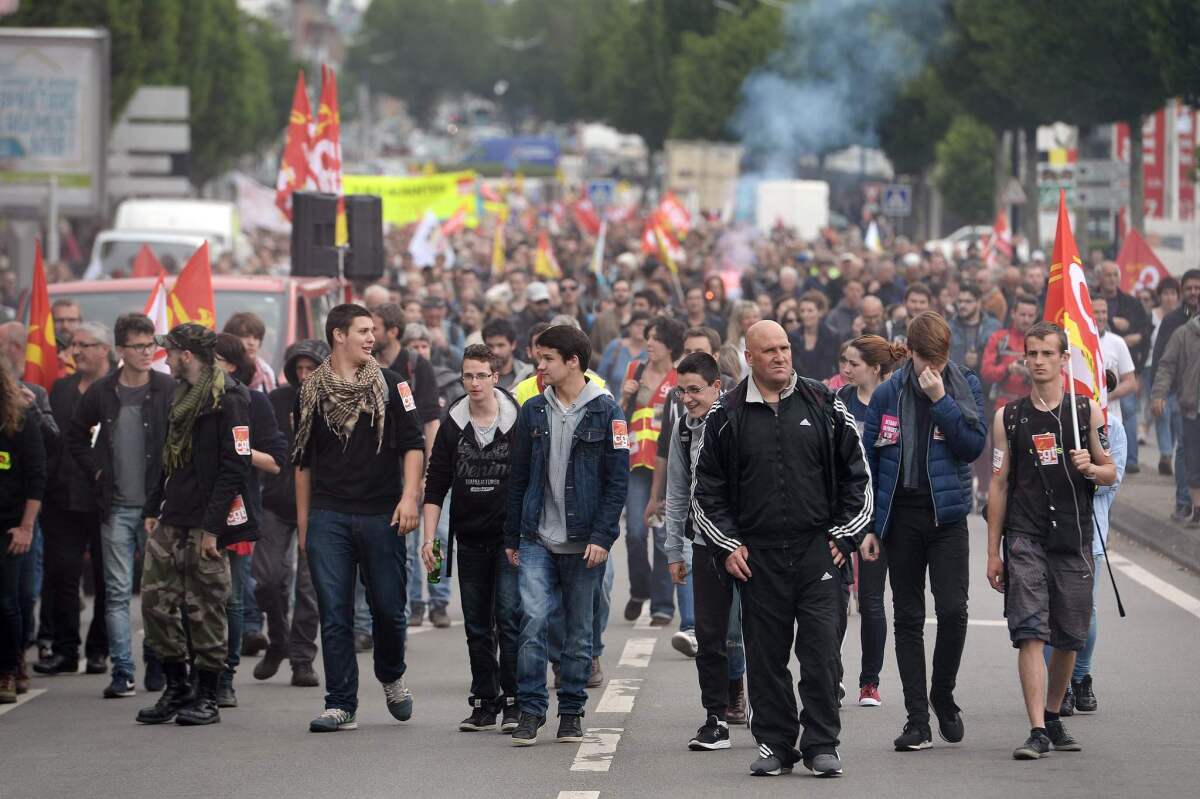 Demonstrators march in Nantes, France, during a protest against planned labor reforms by the government.
