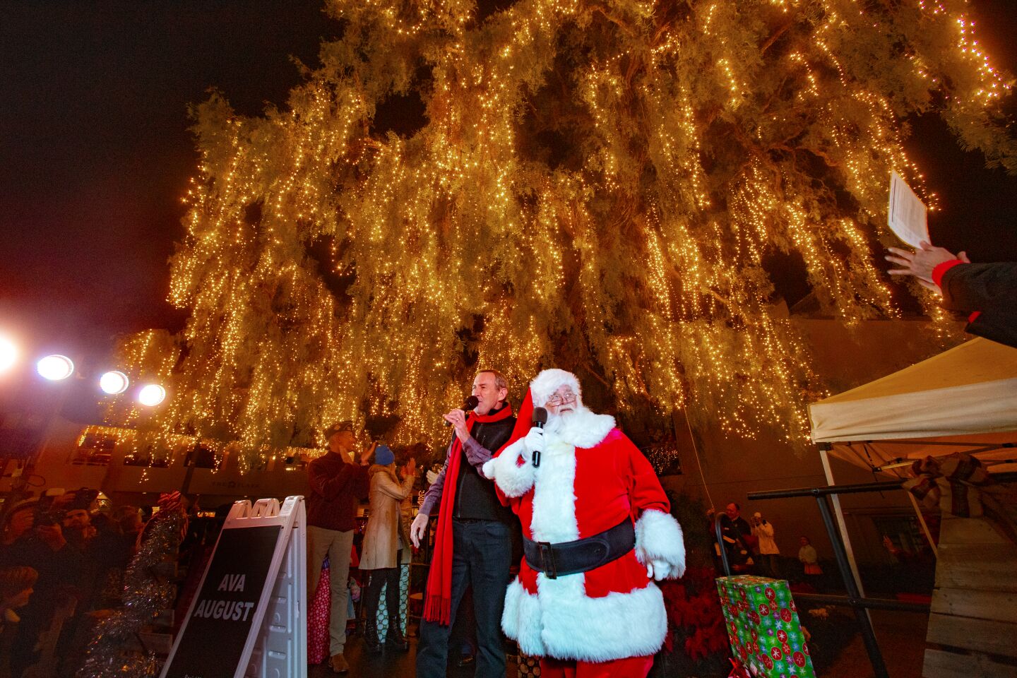Laguna Beach Mayor Bob Whalen joins Santa in lighting the city's Christmas tree at Friday's Hospitality Night.