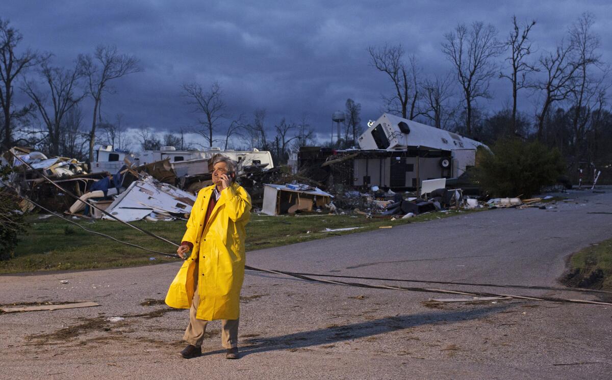 Director of Emergency Operations for St. James Parish Blaise Gravois talks on the phone at Sugar Hill RV Park following a storm in Convent, La.