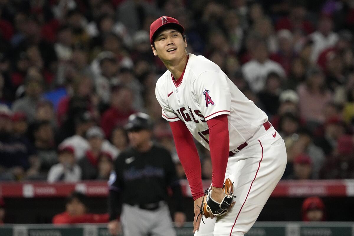 Shohei Ohtani reacts after a ball was called on one of his pitches.