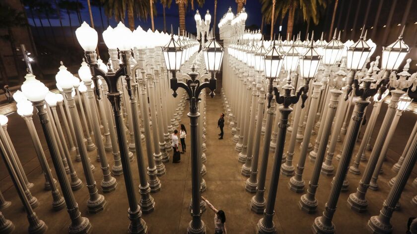 Changes are afoot at LACMA, where Chris Burden's "Urban Light" greets visitors.